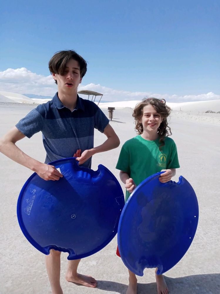 Two of myy grandsons while on vacation.  We spent two full days in the white sands and they sled down them and had a blast. The 14 yr old is at an awkward stage.  He grew many inches in a year.  Just got his braces off and his voice is cracking and he has a "mustache??"  Thankfully, he is still a kid at heart.